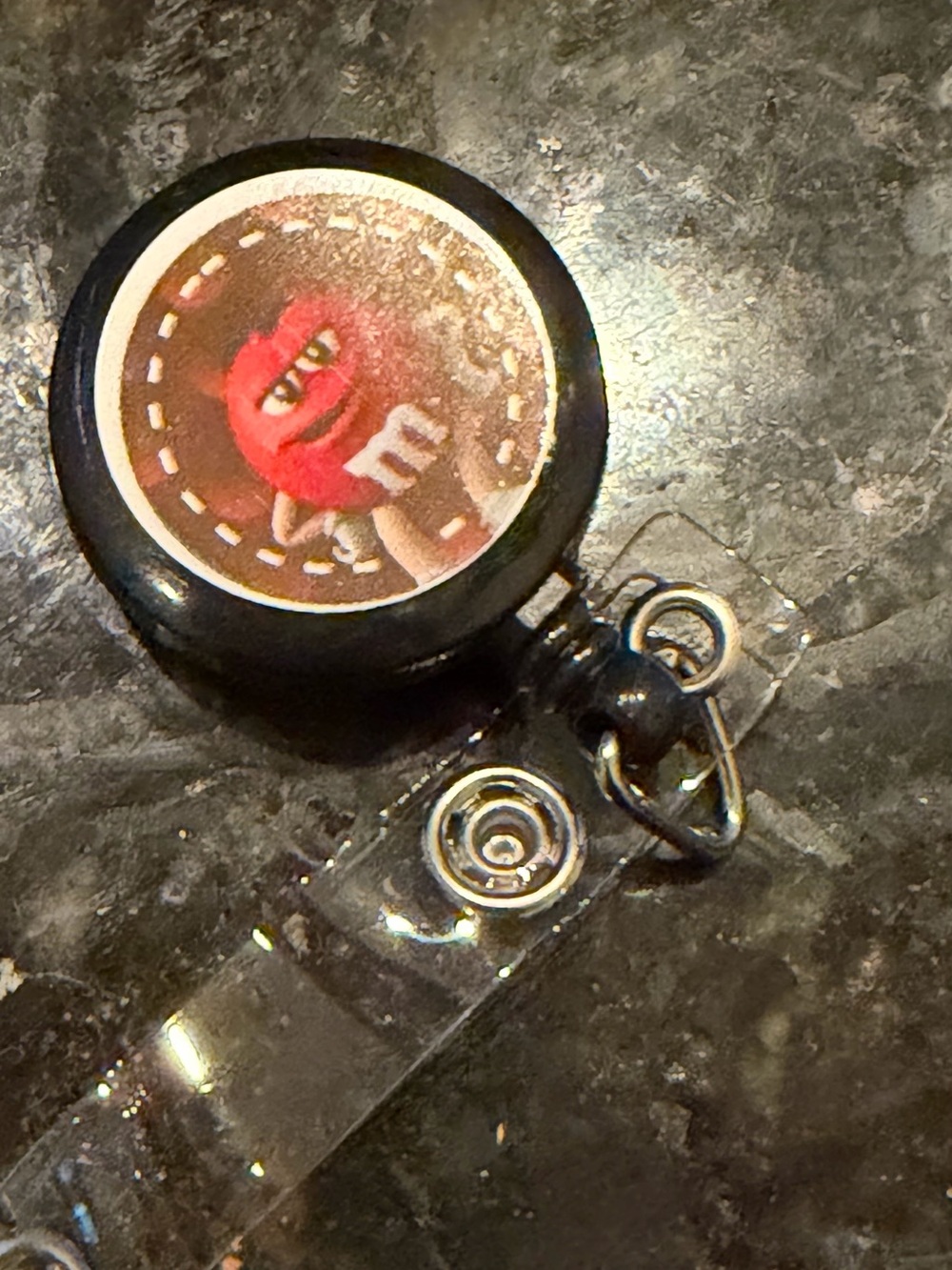 Black Retractable Badge Reel with Red Character Accent